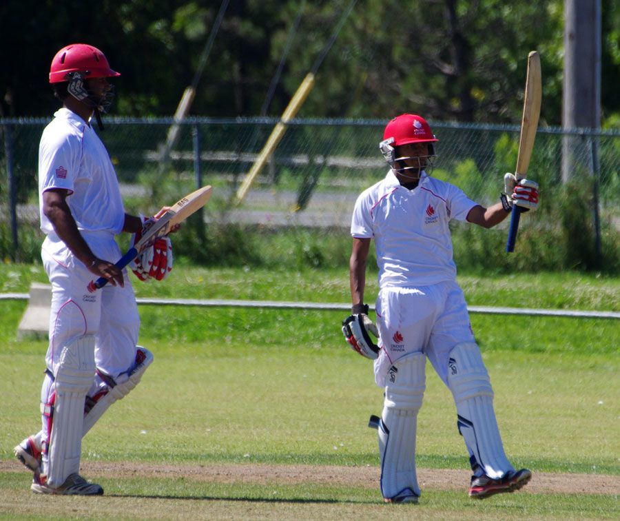 Salman Nazar raises his bat after scoring a half-century