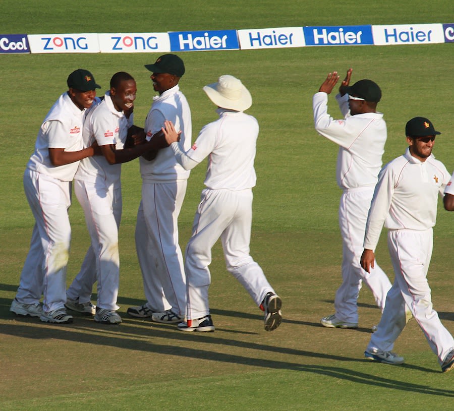 Shingi Masakadza is mobbed after dismissing Misbah-ul-Haq