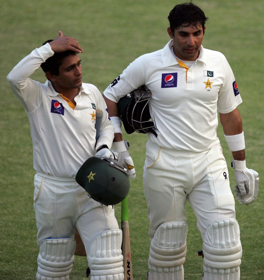 Misbah-ul-Haq and Adnan Akmal walk off the pitch at the end of the day