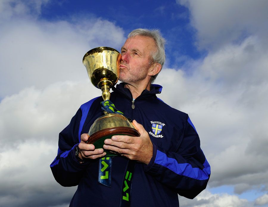 Geoff Cook kisses the Championship trophy