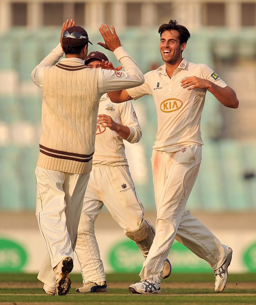 Tom Jewell celebrates a wicket in the autumn sunlight
