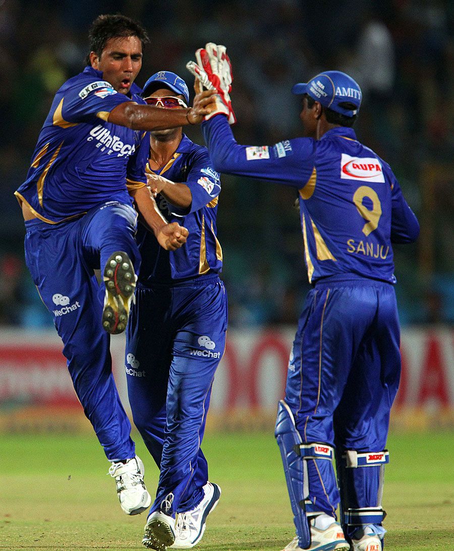 Vikramjeet Malik and his team-mates celebrate a wicket