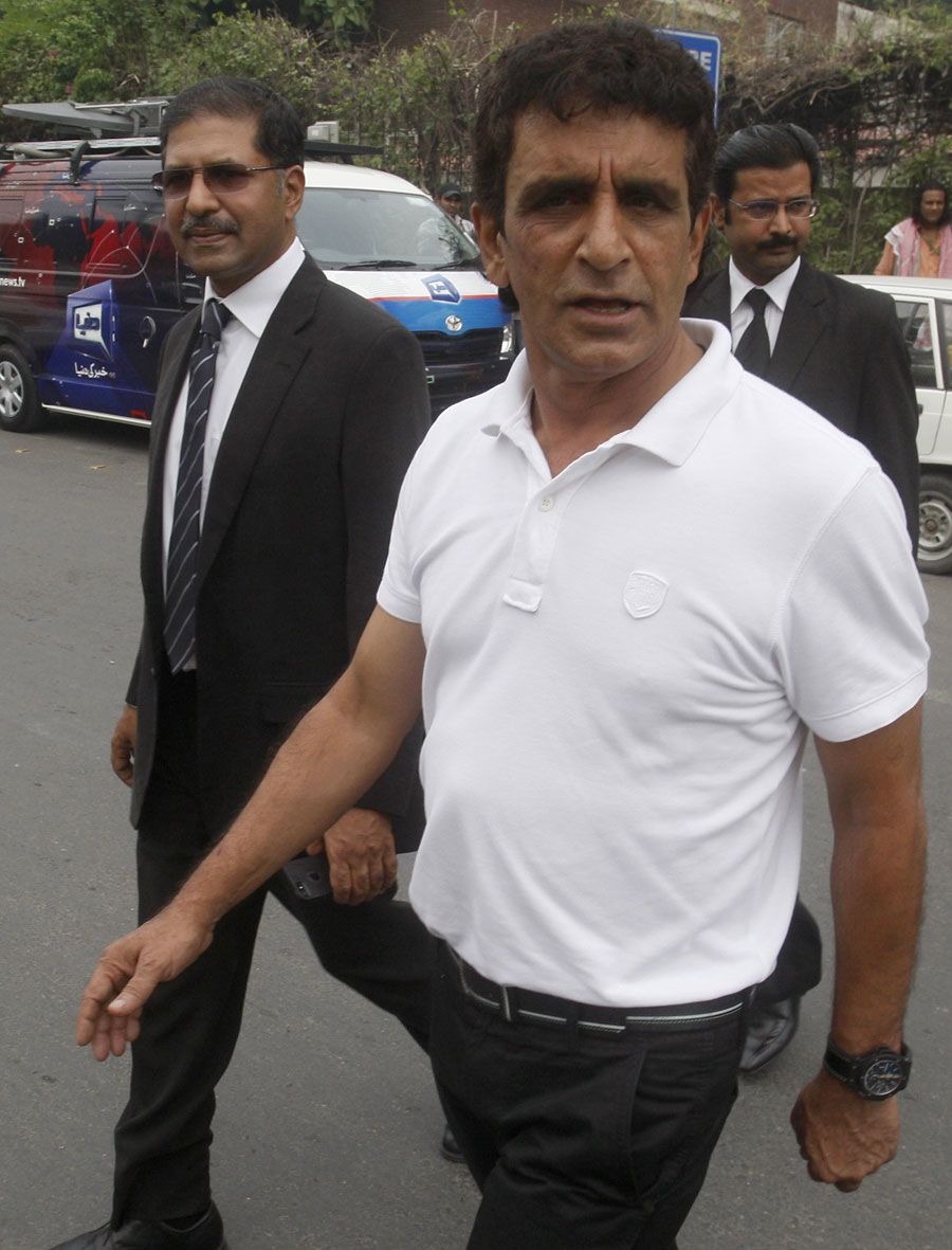 Asad Rauf leaves the press conference with his lawyer Syed Ali Zafar 