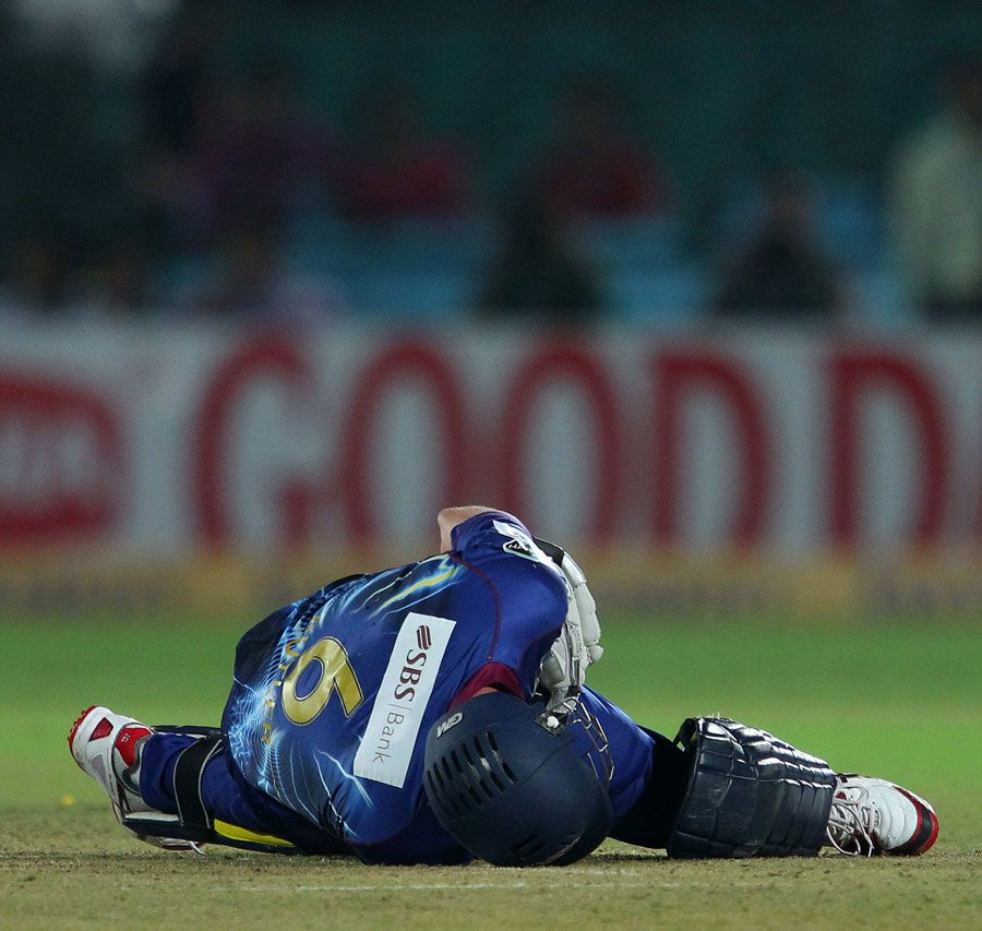 Ian Butler is on the ground after being struck by a full toss