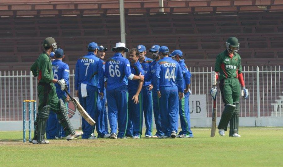 Offspinner Karim Sadiq celebrates with team-mates after taking a wicket