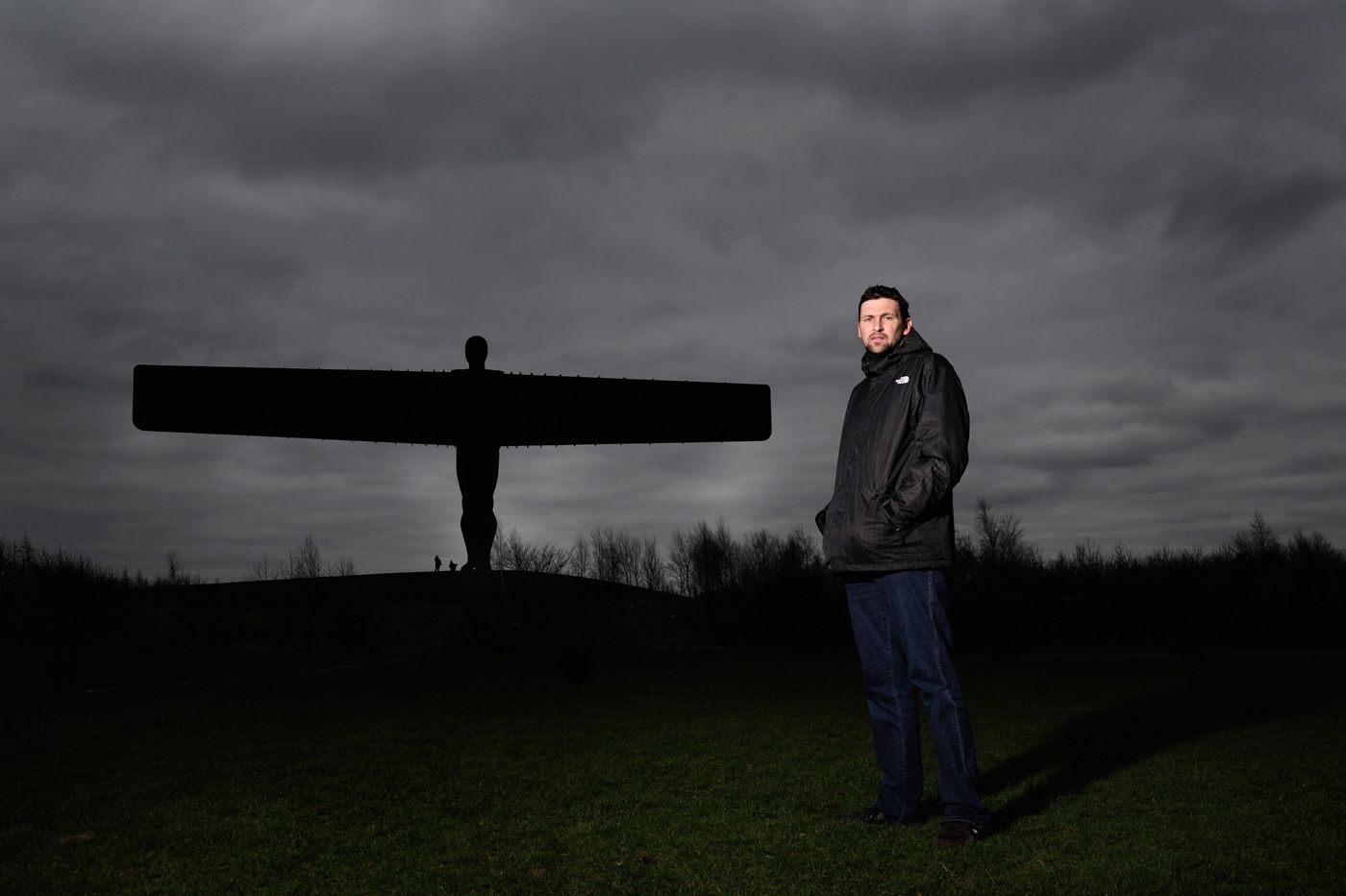 Steve Harmison poses by the Angel of the North