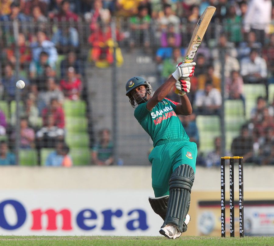 Naeem Islam plays a lofted shot down the ground