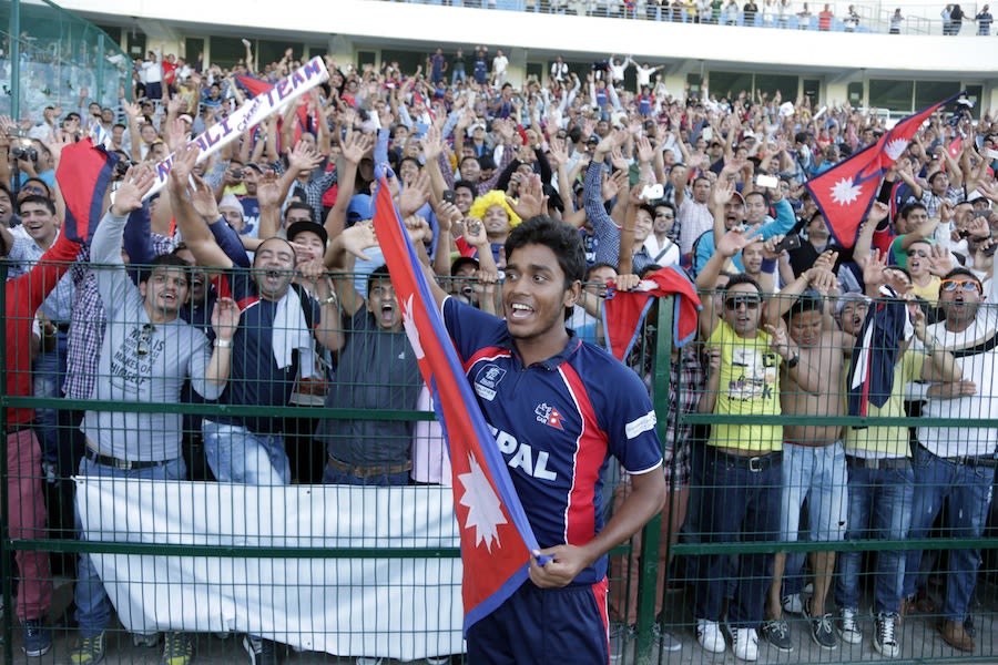 Avinash Karn celebrates with Nepal's fans after they qualified for the World T20
