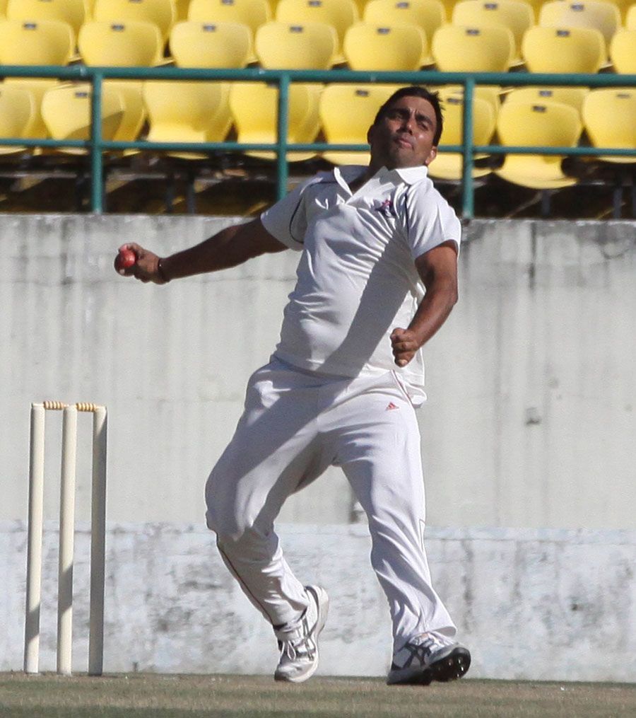 Vikramjeet Malik gets ready to release the ball 