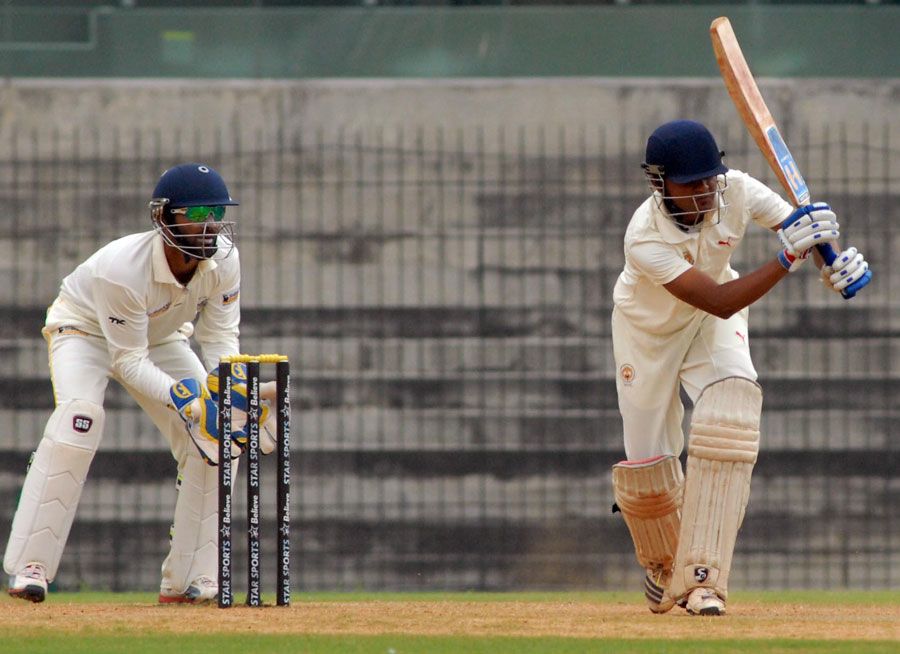 Baroda's Dhiren Mistry plays an on-drive