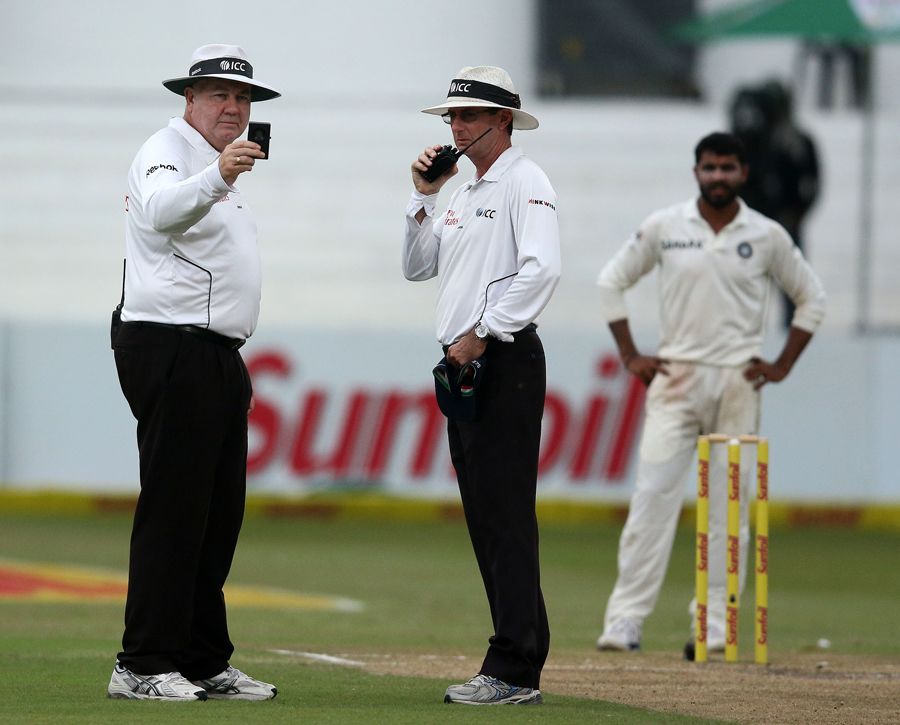 The umpires have a look at the light meter