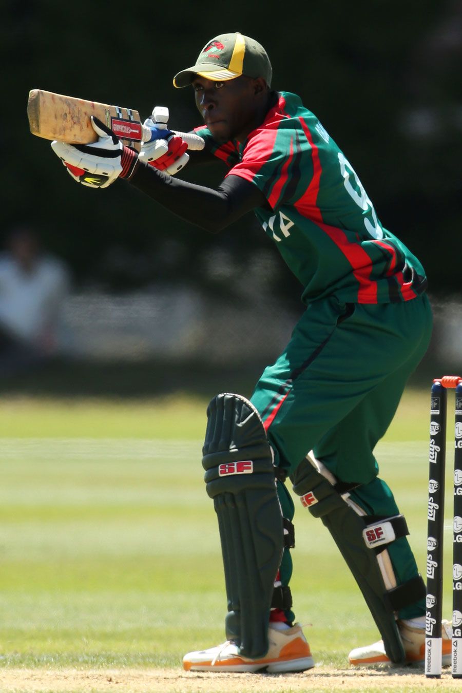 Alex Obanda celebrates after scoring a fifty
