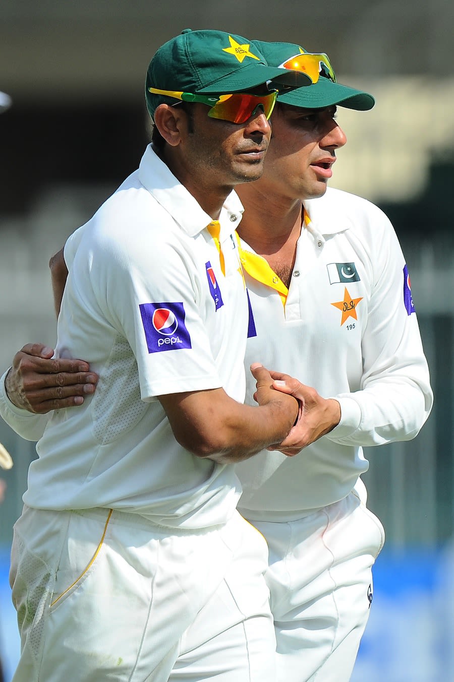 Abdur Rehman and Saeed Ajmal congratulate each other after ending Sri Lanka's innings