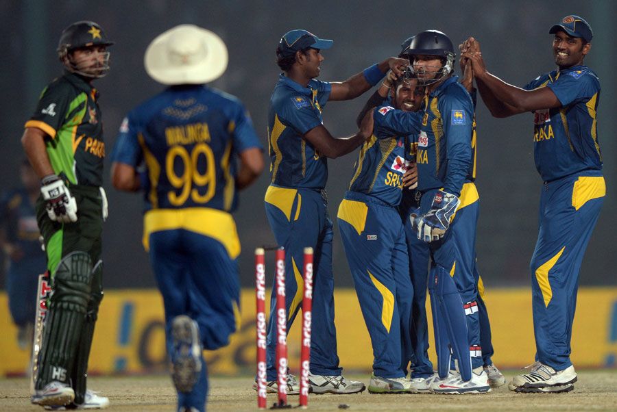 Team-mates congratulate Chaturanga de Silva for his maiden ODI wicket