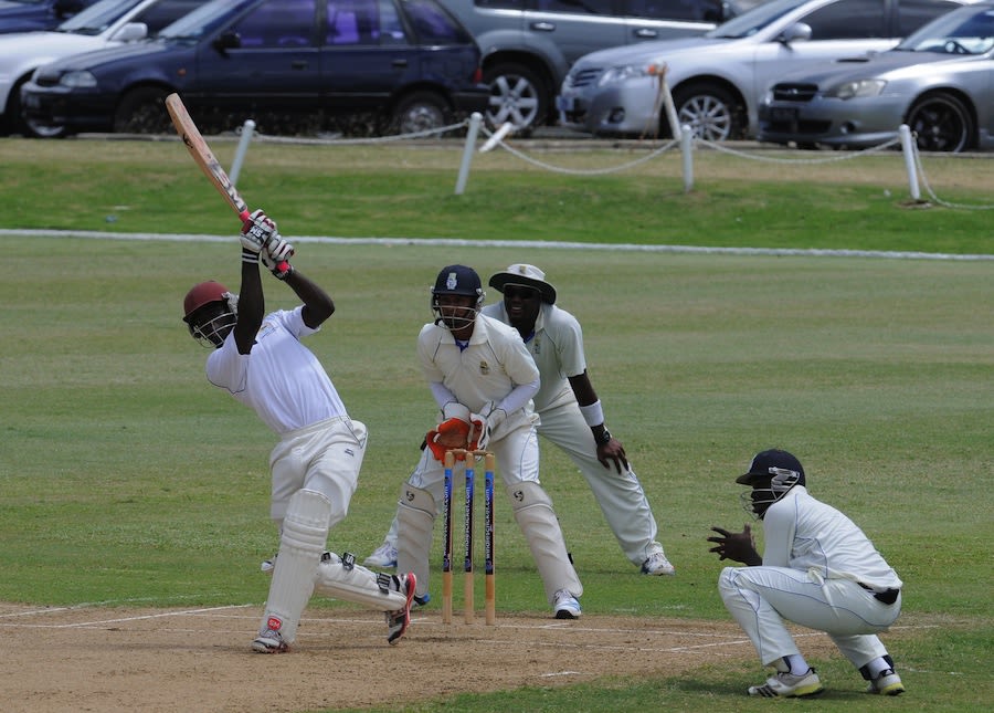 Kyle Corbin hits down the ground during his fifty