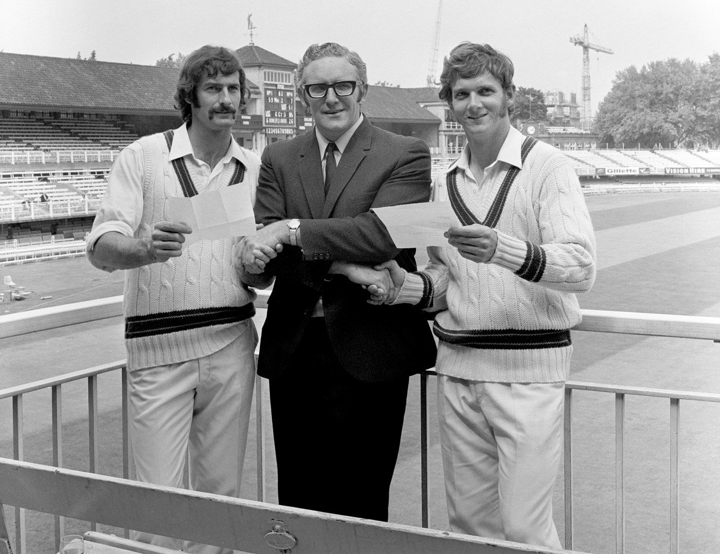 Dennis Lillee and Bob Massie shake hands with former Australian allrounder Alan Davidson