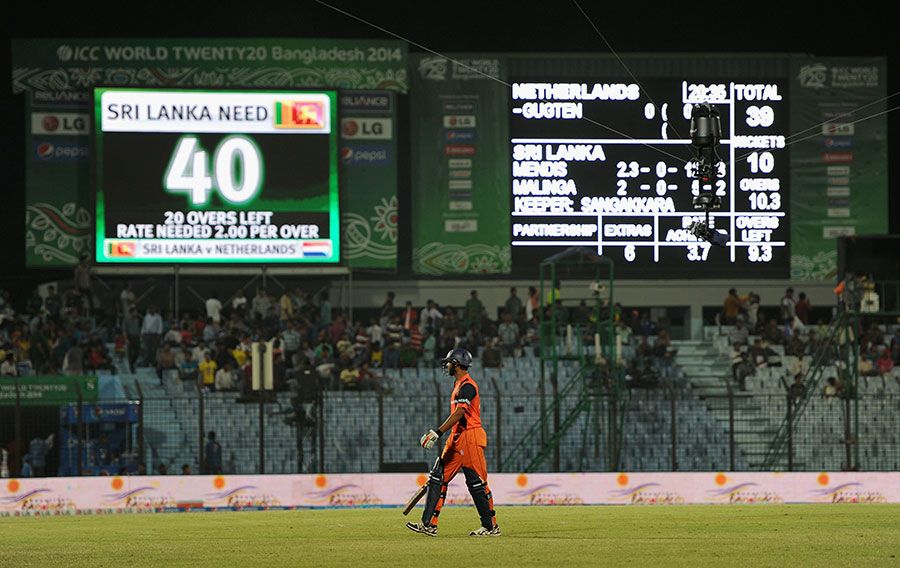 Ahsan Malik walks back as the scoreboard confirms Netherlands' plight