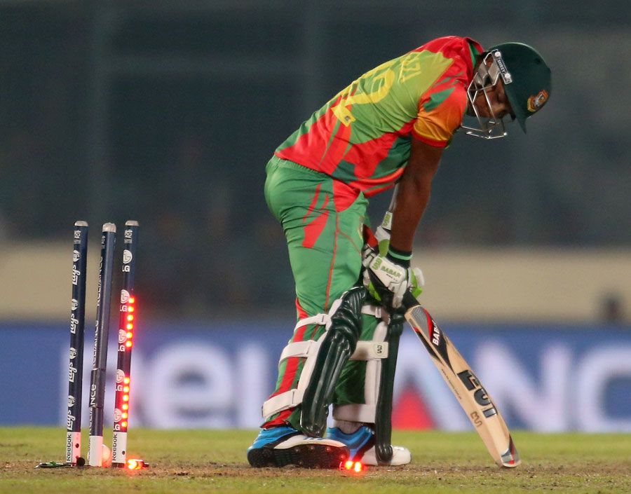 Sohag Gazi is bowled by an Andre Russel yorker