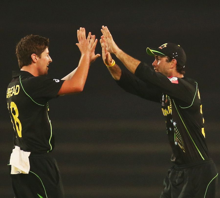 James Muirhead and Glenn Maxwell celebrate the wicket of Chris Gayle