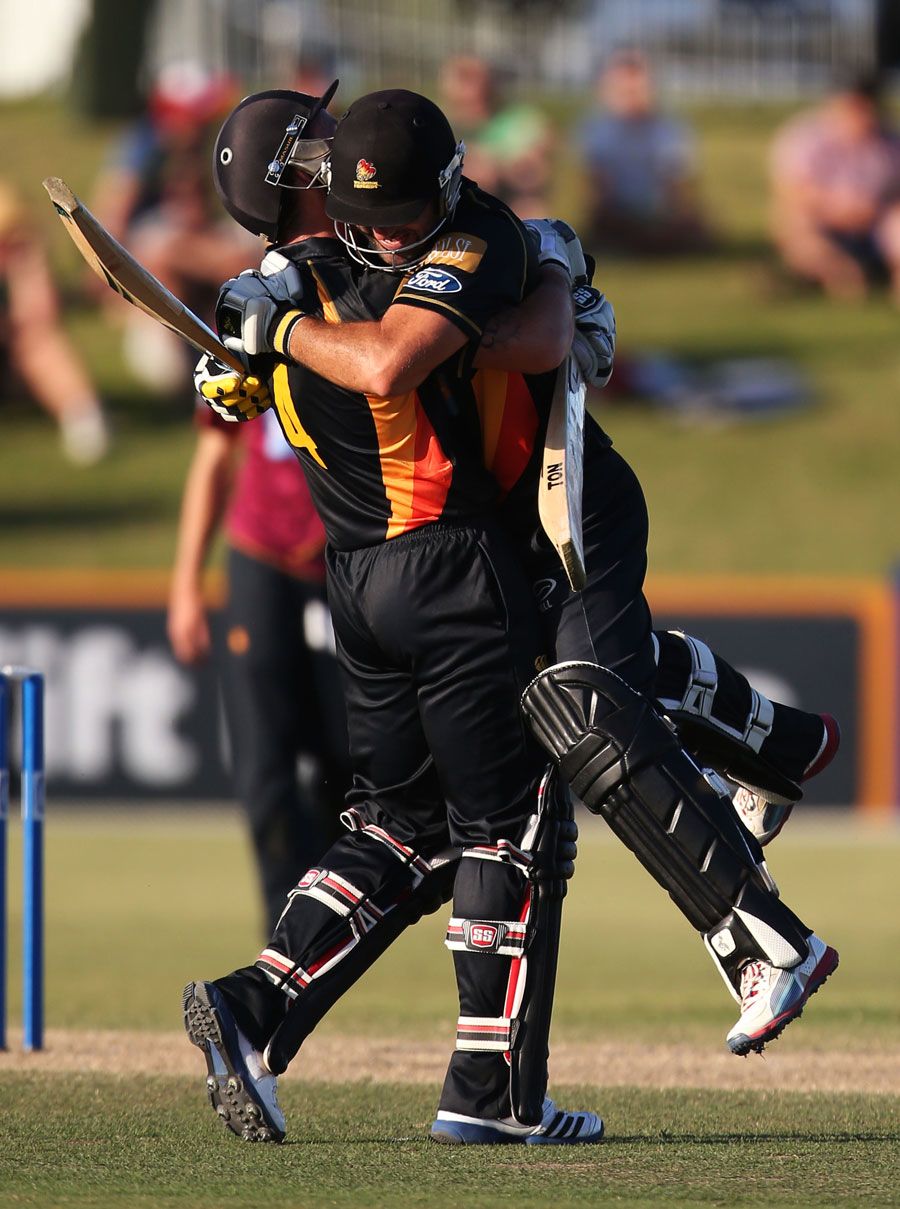 Luke Ronchi and Luke Woodcock celebrate the winning runs