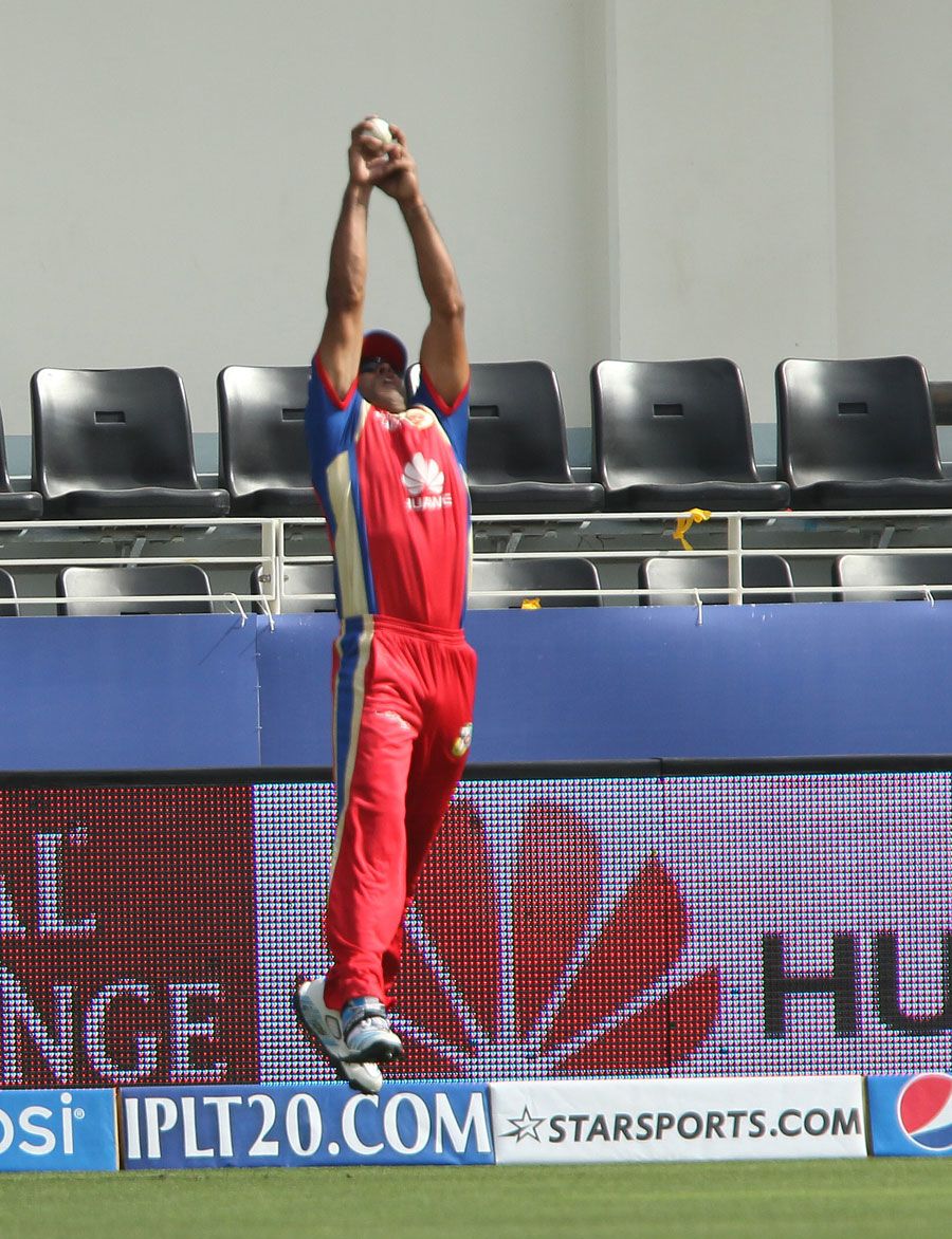 Sachin Rana times his leap to perfection to take the catch of Kieron Pollard