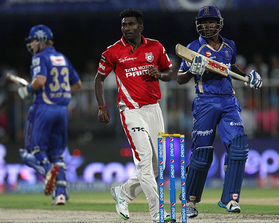 Sanju Samson takes a run while Parvinder Awana looks on