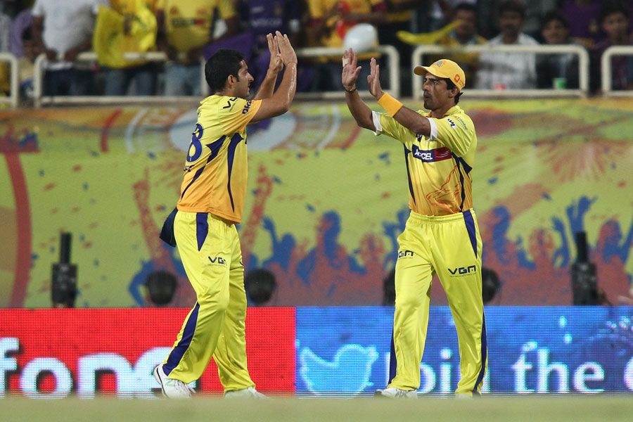 Mithun Manhas is congratulated after taking the catch to send Jacques Kallis back