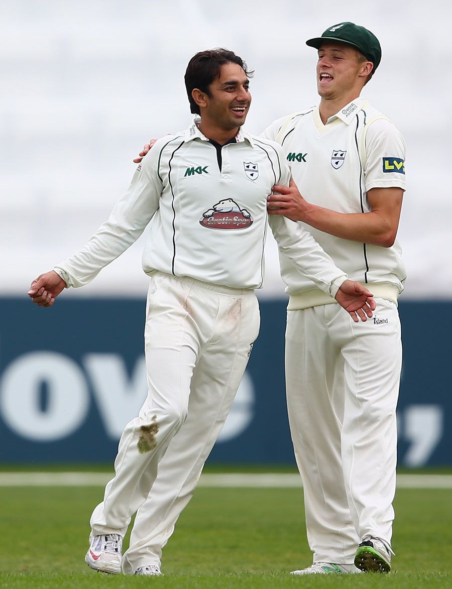 Saeed Ajmal celebrates a wicket with Alexei Kervezee