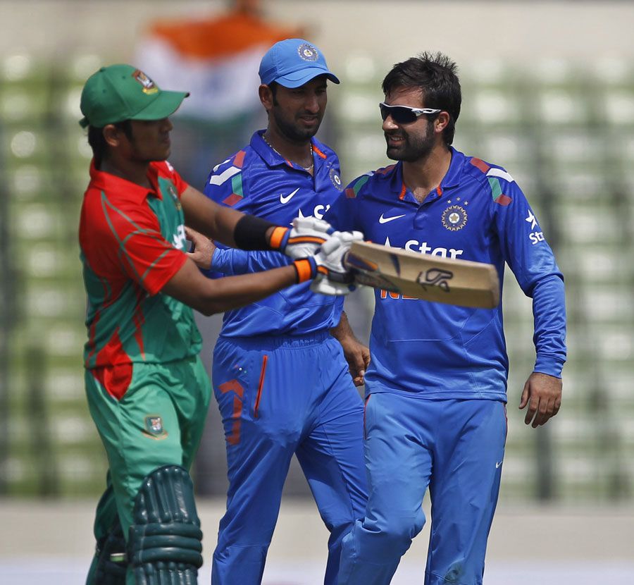 Parvez Rasool finished with 2 for 60