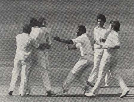 Malcolm Nash is congratulated by his team-mates,
