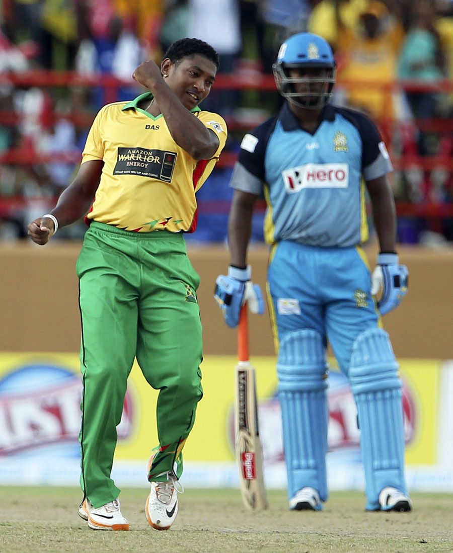 Krishmar Santokie celebrates after taking a wicket
