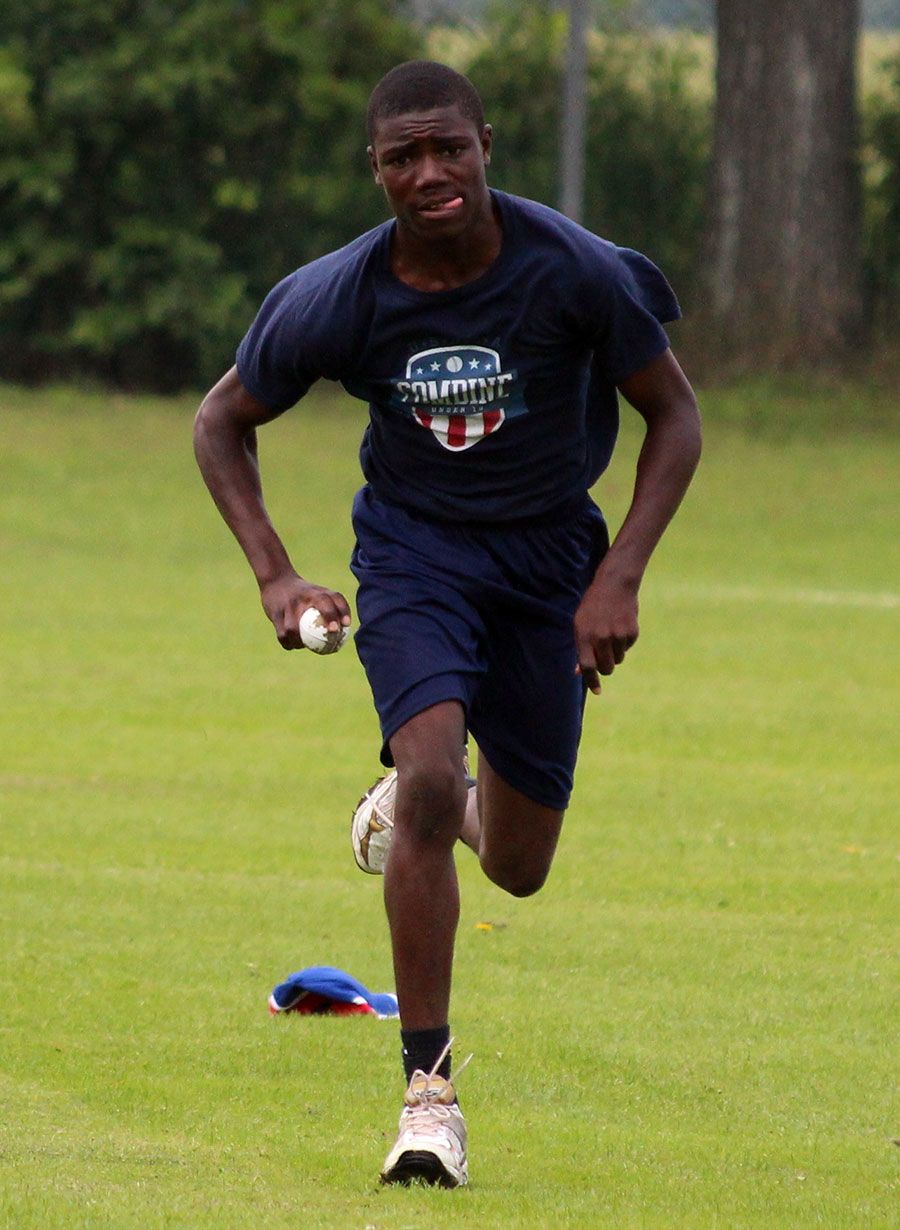 Keifer Phill runs in to bowl