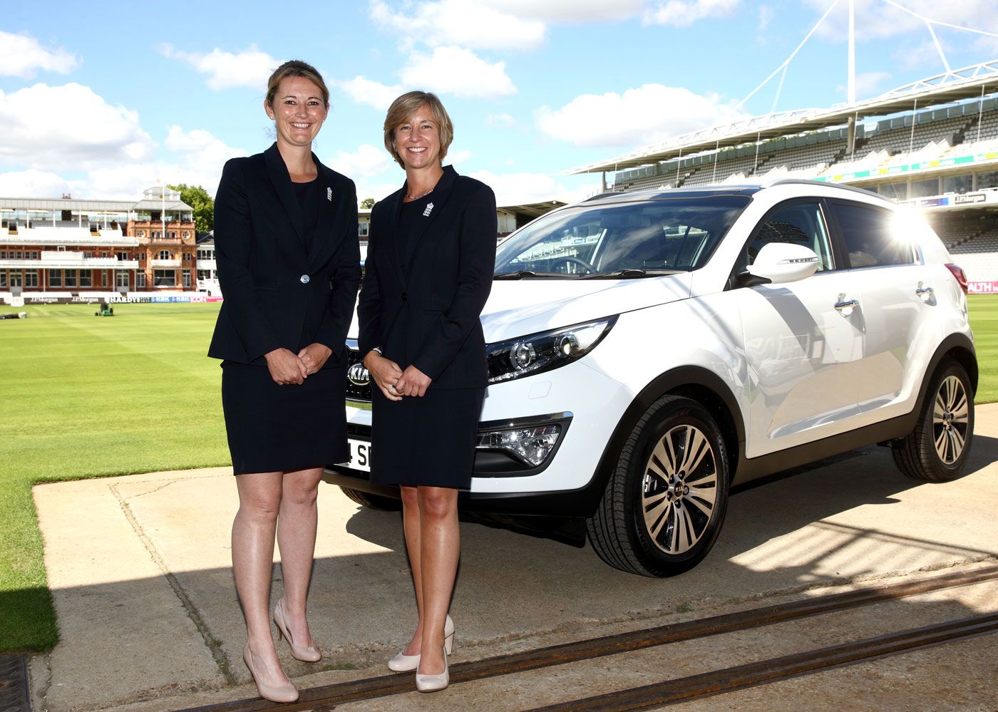 England captain Charlotte Edwards and the ECB's head of women's cricket Clare Connor pose with a Kia Sportage