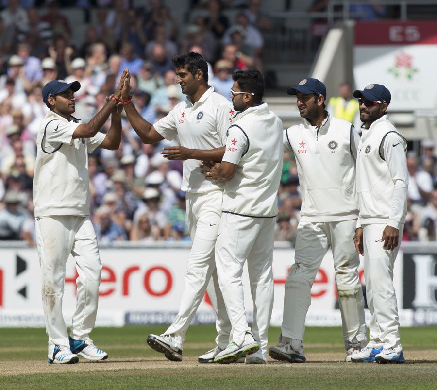 Pankaj Singh is congratulated after his first Test wicket