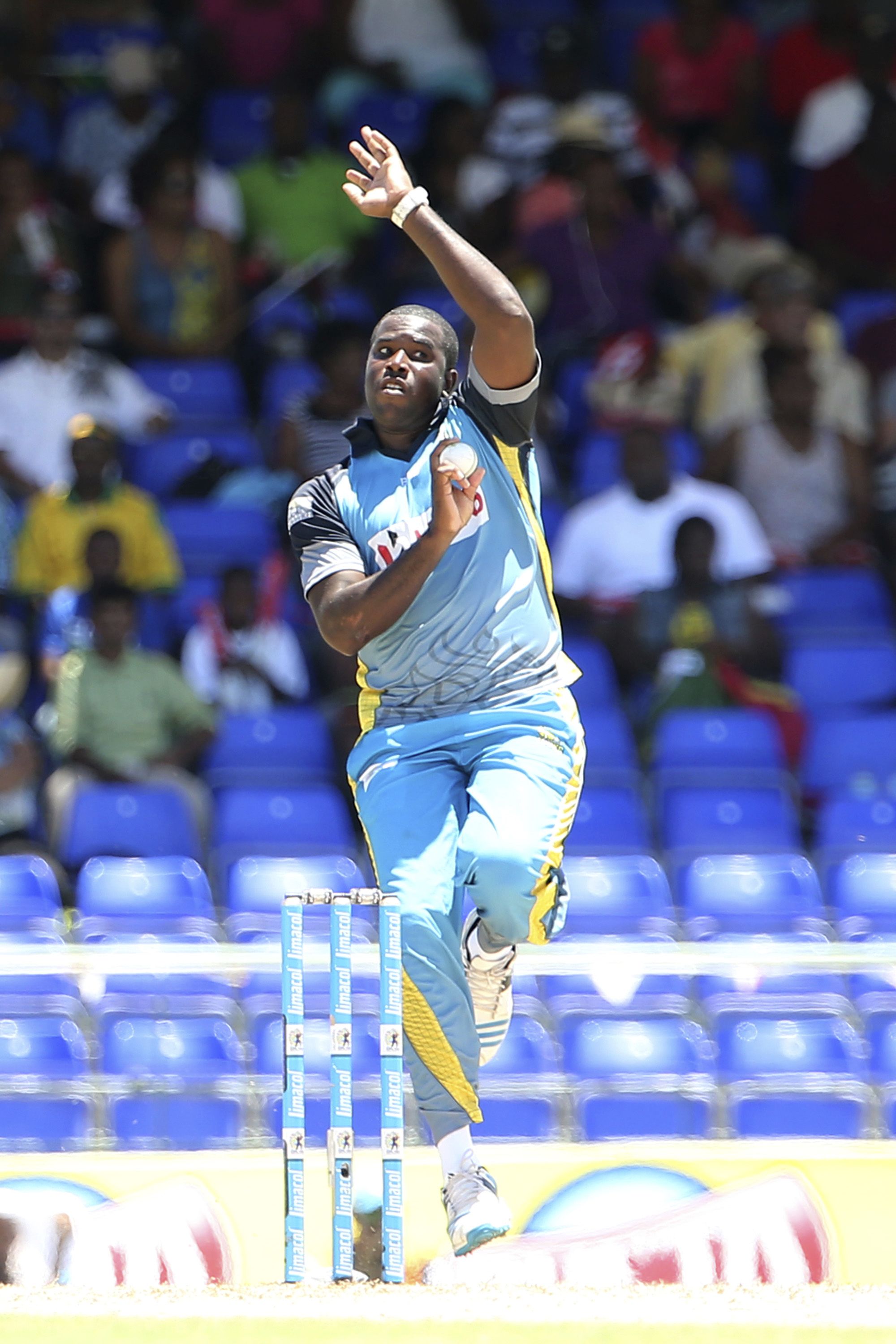 Mervin Mathew charges in to bowl