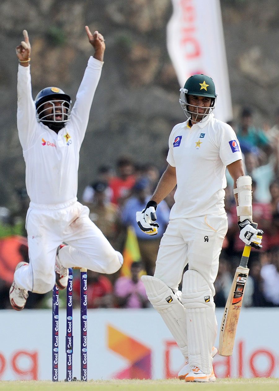 Kaushal Silva leaps in joy after the wicket of Mohammad Talha
