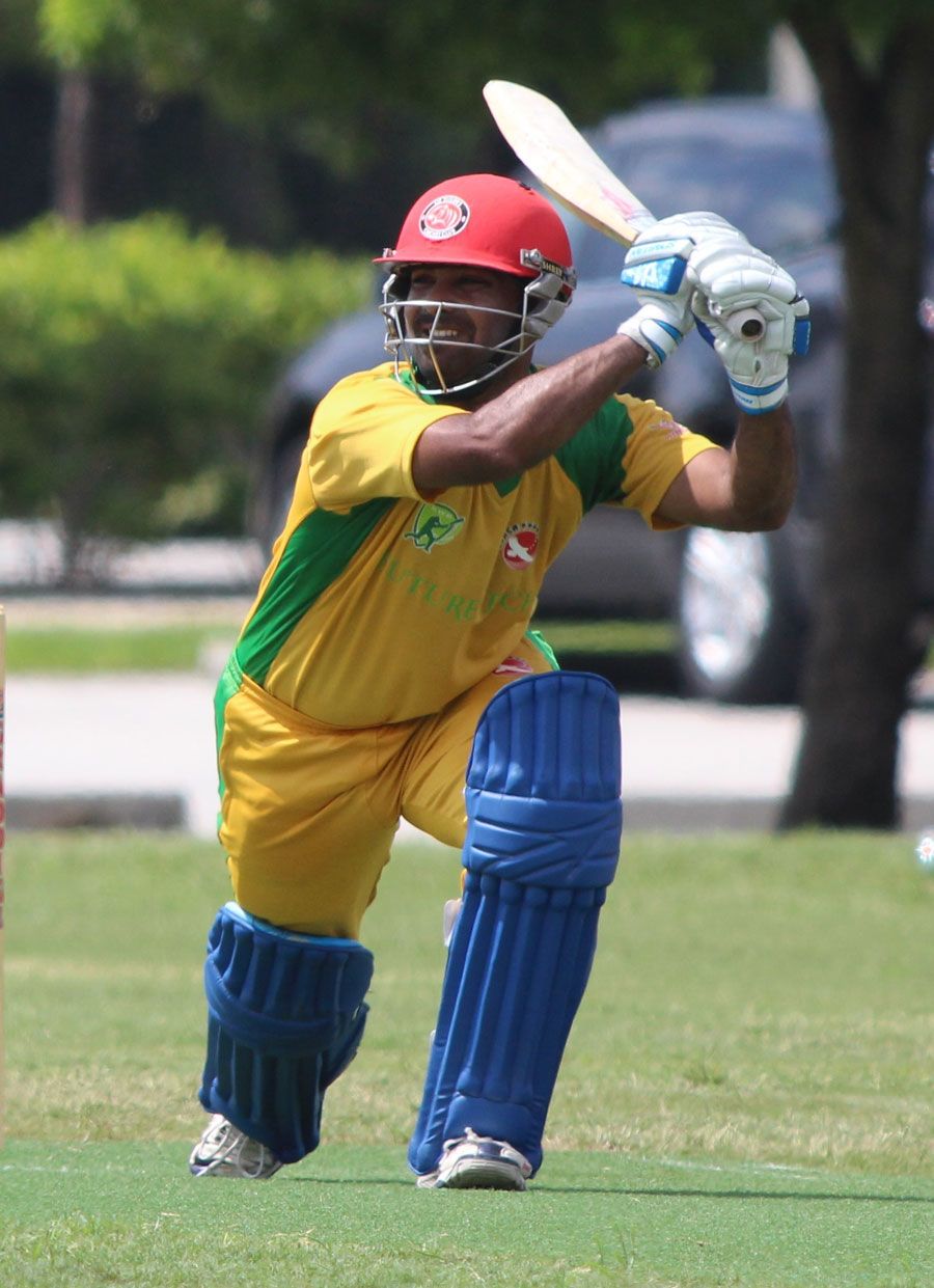 Ritesh Kadu drives through the off side