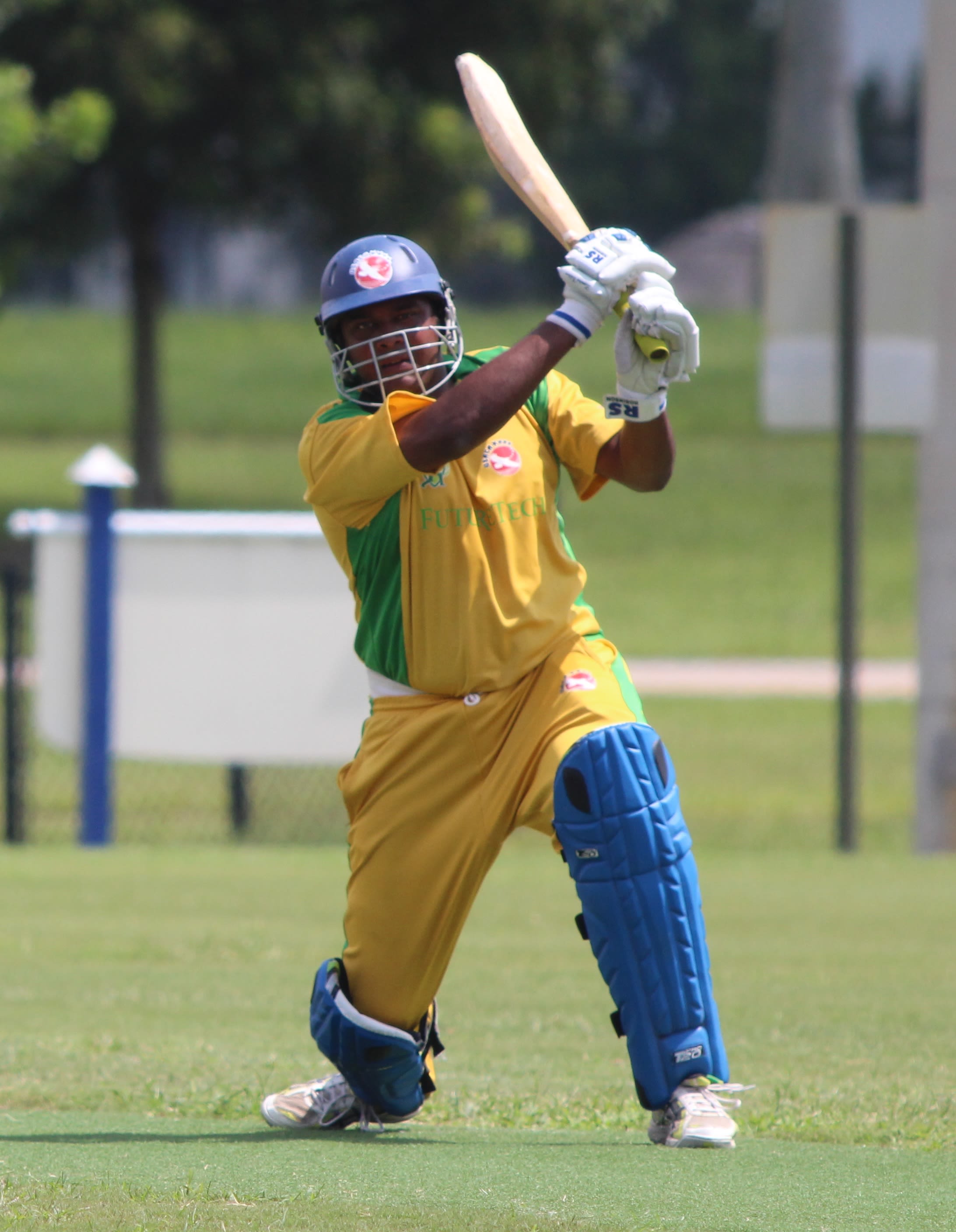 Aditya Thyagarajan completes a lofted drive over extra cover