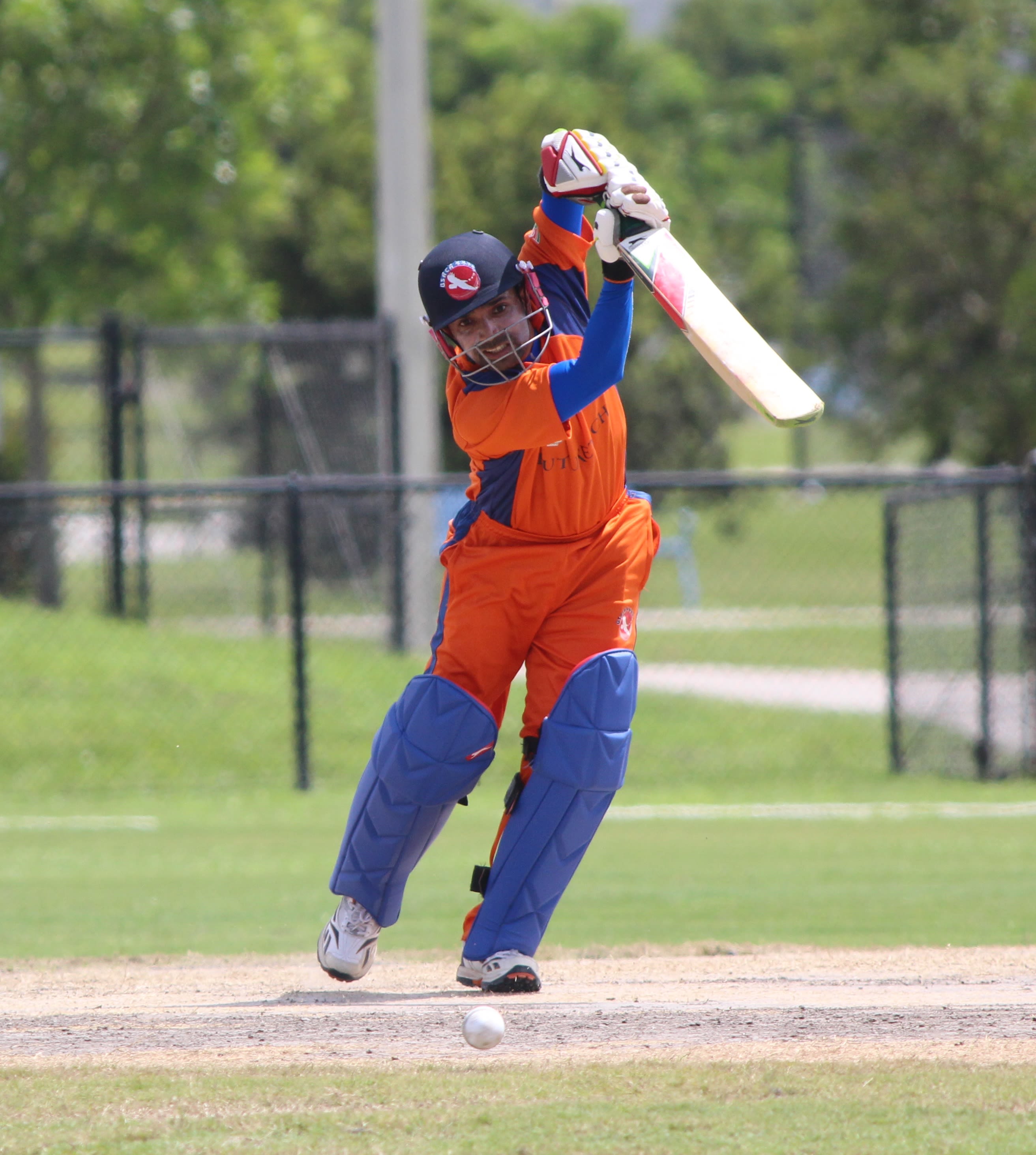 Aditya Mishra punches through the off side