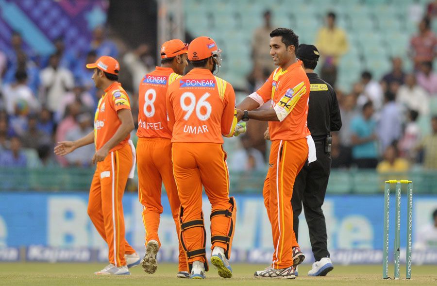 Asif Raza is congratulated after a wicket