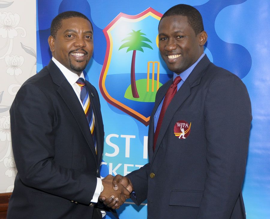 Dave Cameron and Wavell Hinds at the agreement-signing ceremony