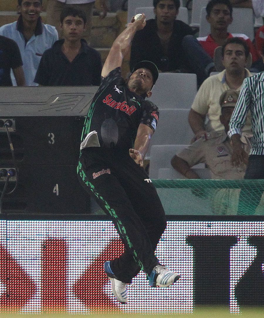 Vaughn van Jaarsveld leaps to try take a catch at the boundary