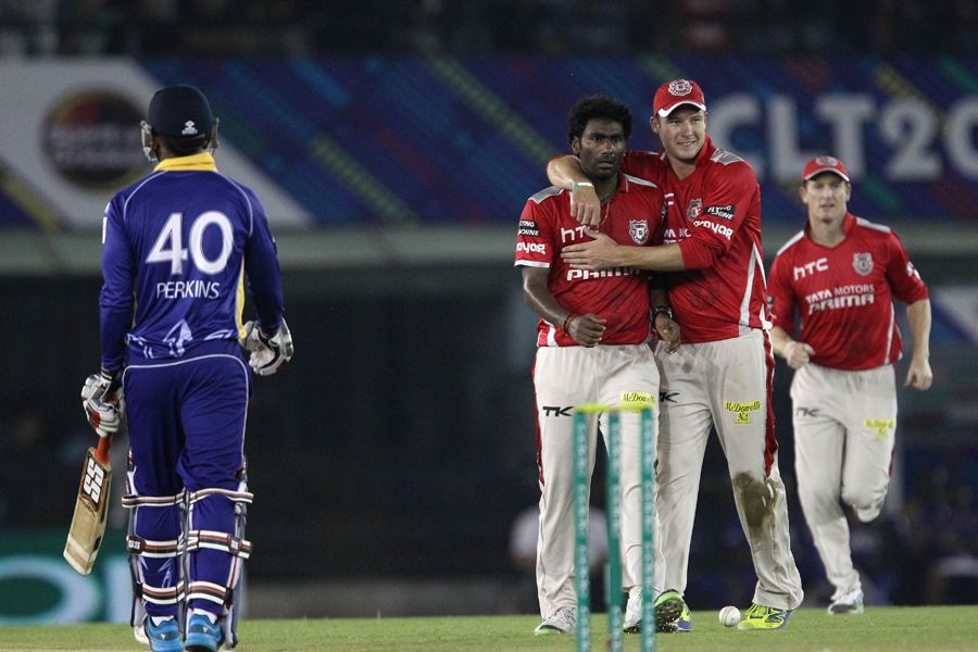 Parvinder Awana gets a hug after dismissing William Perkins