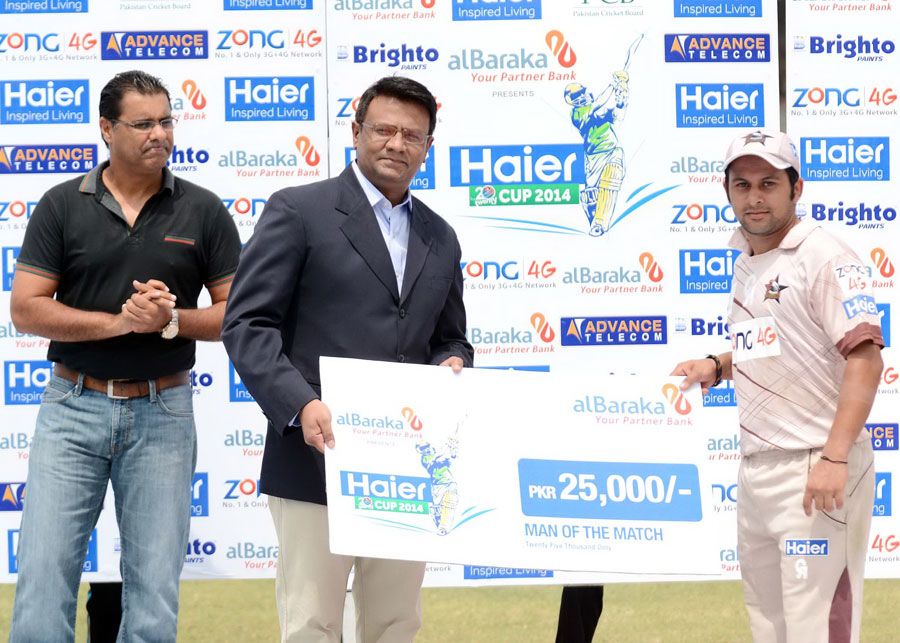 Azeem Ghumman receives the Man-of-the-Match award for his unbeaten 50
