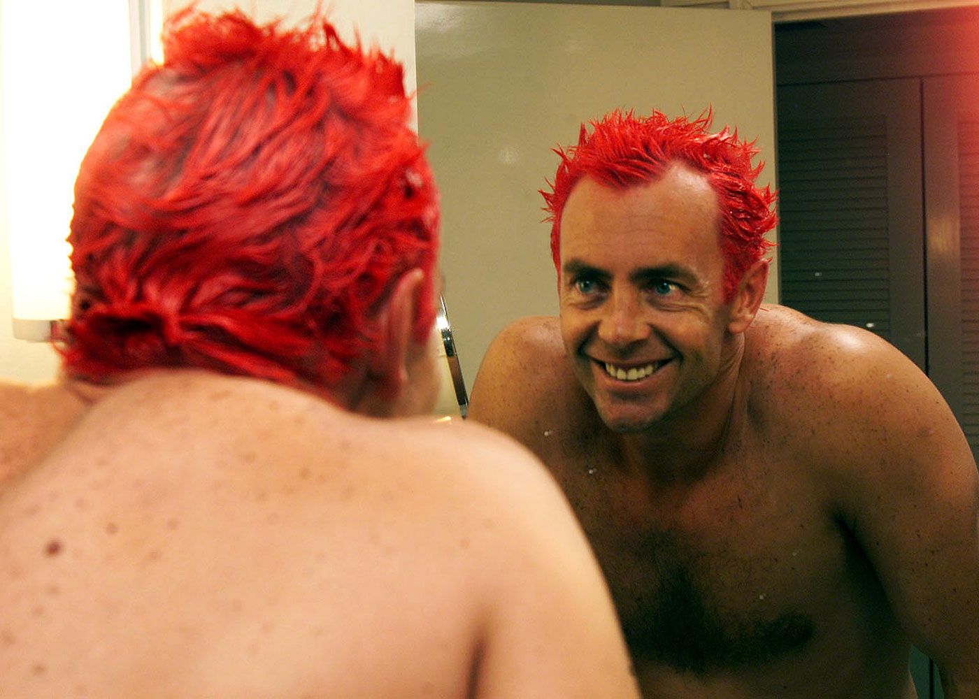Colin Miller checks out his red hair