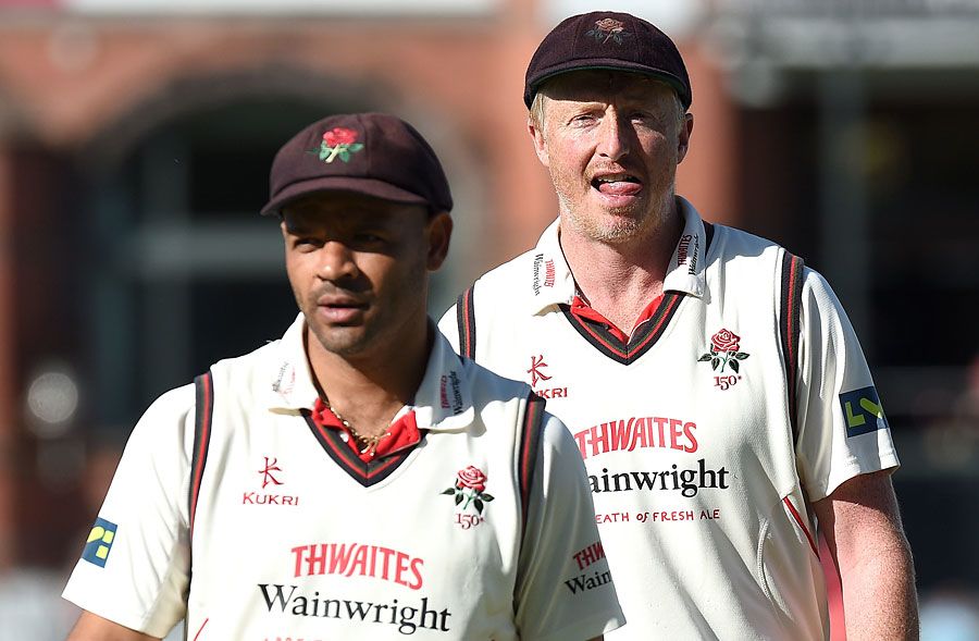 Ashwell Prince and Glen Chapple walk off the ground