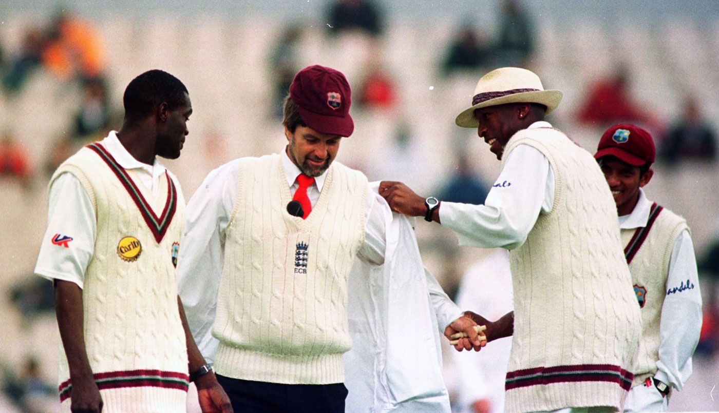 Reon King and Franklyn Rose joke with umpire Peter Willey