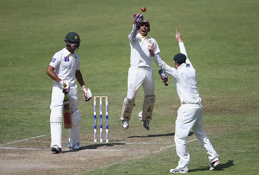 Australia's stand-in wicketkeeper Saqlain Haider celebrates a catch