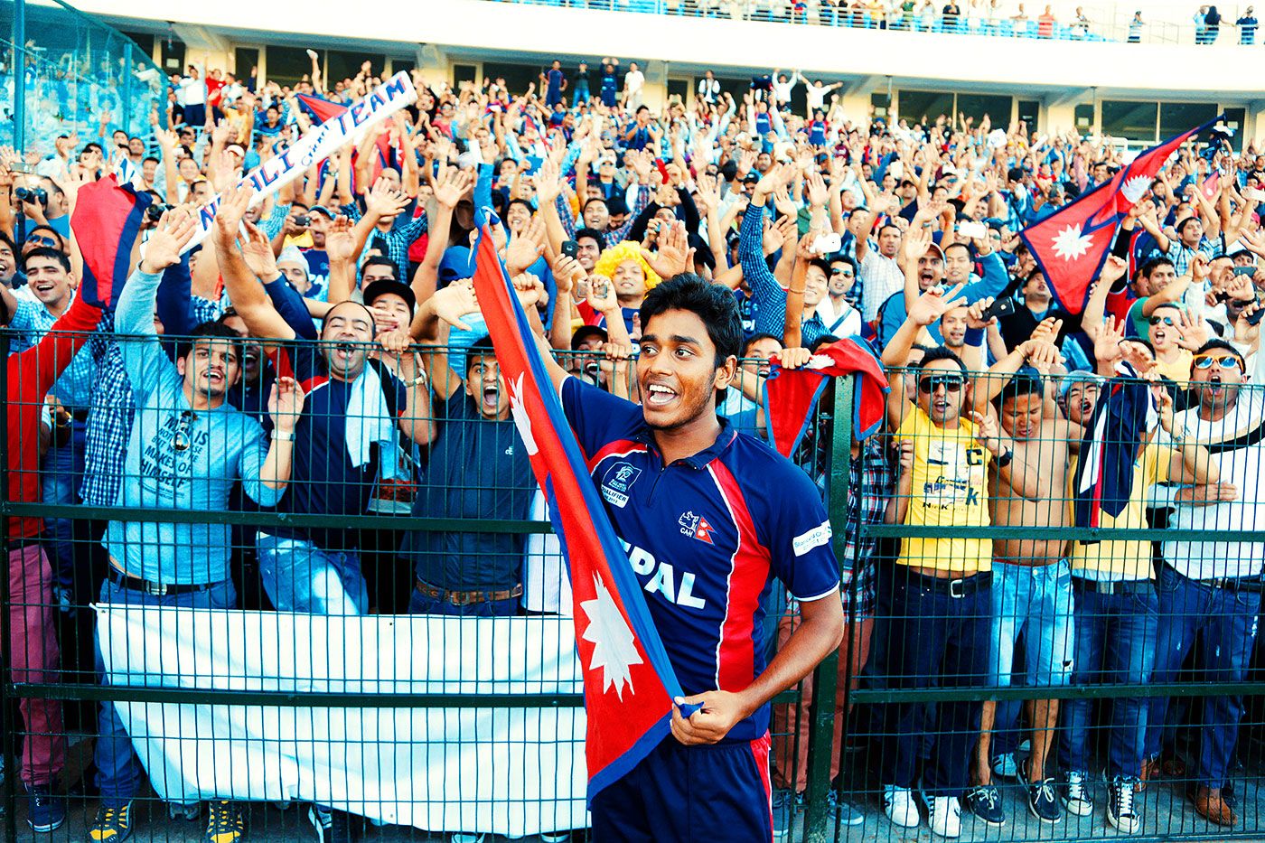 Avinash Karn celebrates with Nepal's fans after they qualified for the World T20