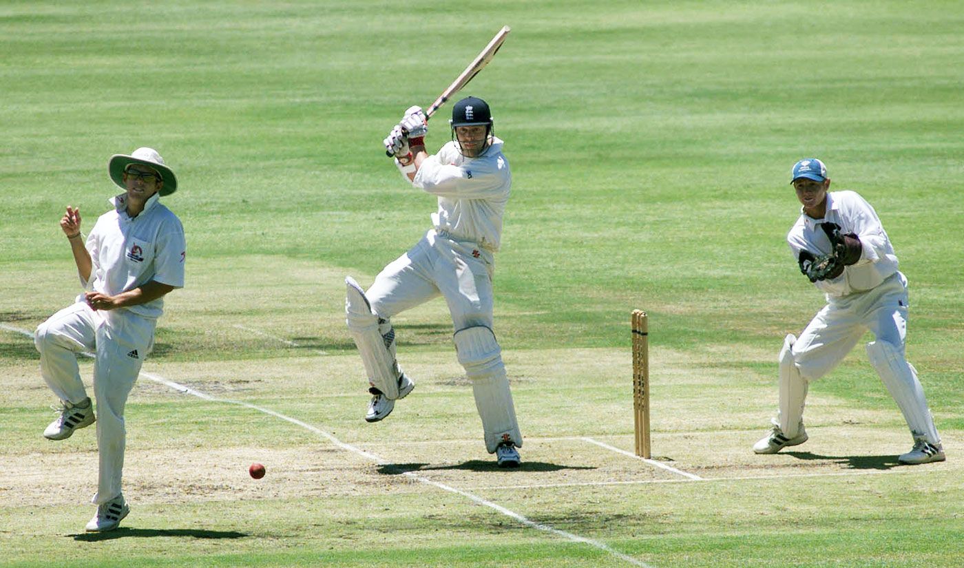 Nick Knight on his way to a century watched by wicketkeeper Wendell Bossenger